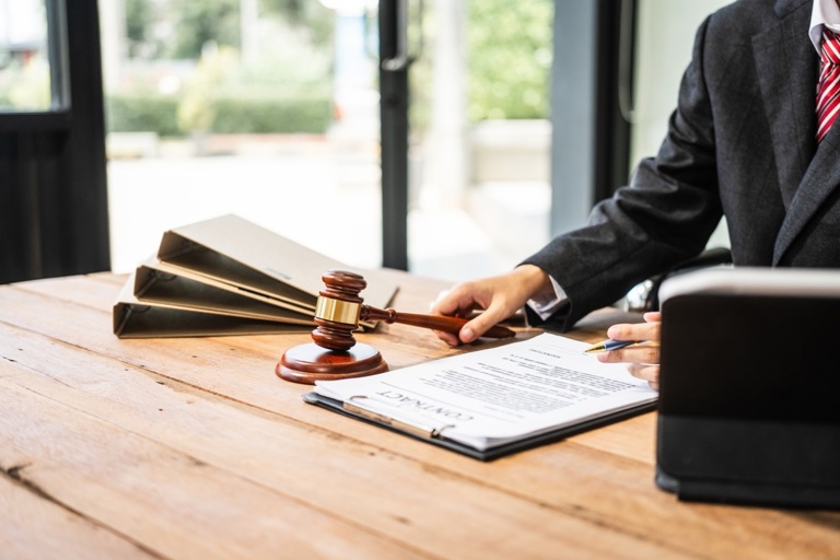 A,Young,Businesswoman,Is,Working,At,Her,Desk,,Diligently,Preparing